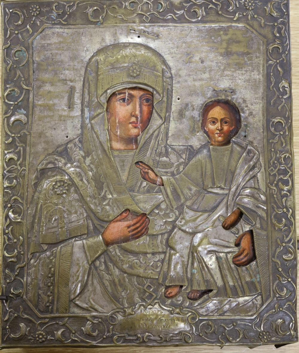 A 18th/19th century Russian painted wood icon with silvered brass oklad, Saint Theotohos Modegestria